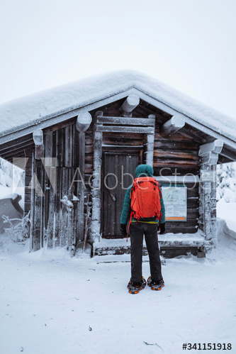 woman,standing,front,snowy,hut,home,alone,approach,architecture,backpack,building,cabin,cold,countryside,discover,discovery,exploration,female,finland,fire,forest,found,freezing,frosty,glacé,hi-res,house,journey,lapland,leading,lost,natural,nature,1,outdoors,person,fir-wood,rear,snow,snowing,snowshoe,adobestock