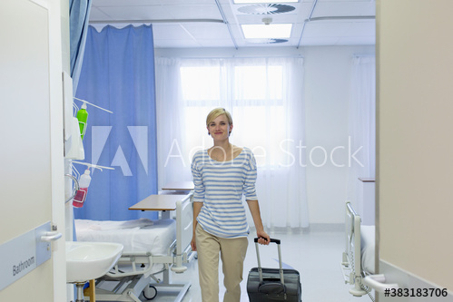 smile,woman,patient,suitcase,leaves,hospital,room,adult,young,caucasian,portrait,front view,walk,confident,hold,pull,blond,short hair,discharge,indoor,day,people,1,alone,lifestyle,adobestock