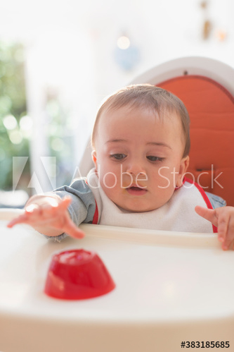 cute,boy,children,baby,achieving,eat,high chair,caucasian,lifestyle,domestic life,indoor,day,people,1,alone,food,adobestock