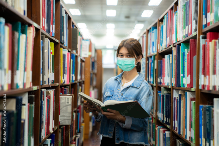 student,woman,mask,school,learning,college,asian,education,protective,flu,health,disease,indoor,library,virus,protection,book,university,young,study,infection,person,studying,textbook,safety,beautiful,girl,reading,epidemic,academic,educational,read,looking,people,lifestyle,20s,literature,bookshelf,resilience,cheerful,adobestock