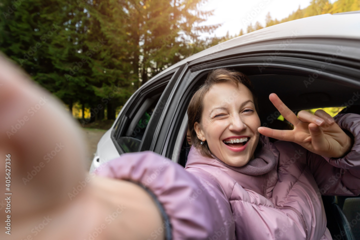 Happy Woman Enjoying Life in the Autumn on the Nature Stock Photo