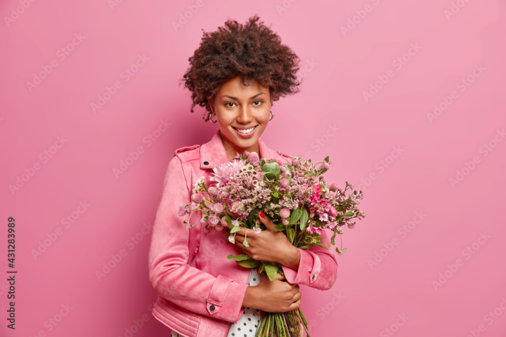 woman,portrait,background,smile,female,bouquet,beautiful,happy,young,bunch,happiness,isolated,holiday,floral,flower,mother,spring,day,march,emotion,person,pretty,adult,attractive,face,lady,event,cute,smiling,fashionable,pink,jacket,cheerful,occasion,curly,charming,celebrate,romantic,posing,toothy,festive,glad,ethnic,pleased,sincere,optimistic,1,magnificent,satisfied,indoor,adobestock