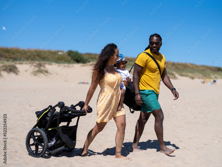 woman,man,boy,adult,mid,children,toddler,group,family,mother,father,son,beach,vacation,playful,relaxation,summer,togetherness,babyhood,active,bond,carefree,enjoyment,smile,gem,britain,lifestyle,fun,horizontal,outdoors,day,cart,multiracial,african,three,people,adobestock
