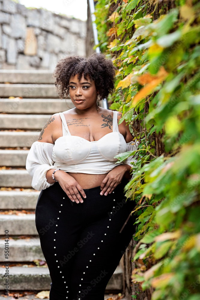 curvy,black woman,black,woman,outside,fall,winter,cold,leaf,stair,fashion,style,curly hair,city,downtown,atlanta,georgia,lifestyle,nature,outdoors,model,park,people,person,hair,adobestock