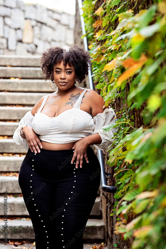 curvy,black woman,black,woman,outside,fall,winter,cold,leaf,stair,fashion,style,curly hair,city,downtown,atlanta,georgia,lifestyle,nature,outdoors,model,park,people,person,hair,adobestock