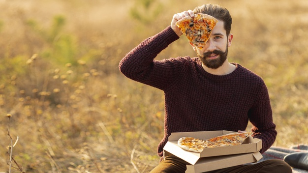showing,bearded,slice,young adult,handsome,relaxation,outdoors,copy,adult,sunlight,male,lifestyle,happiness,young,beard,person,human,space,sun,pizza,nature,man