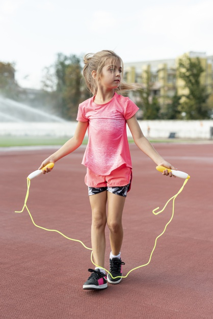 full shot,jumprope,front view,little,outside,sporty,full,front,outdoors,shot,shorts,view,exercise,healthy,tshirt,yellow,child,kid,cute,health,pink,girl,sport