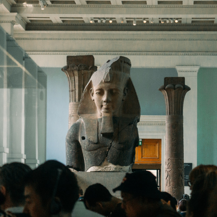 ancient,art,artwork,design,egyptian,exhibit,exhibition,group together,indoors,inside,interior,interior design,men,museum,outfit,people,sculpture,statue,wall,walls,wear,women