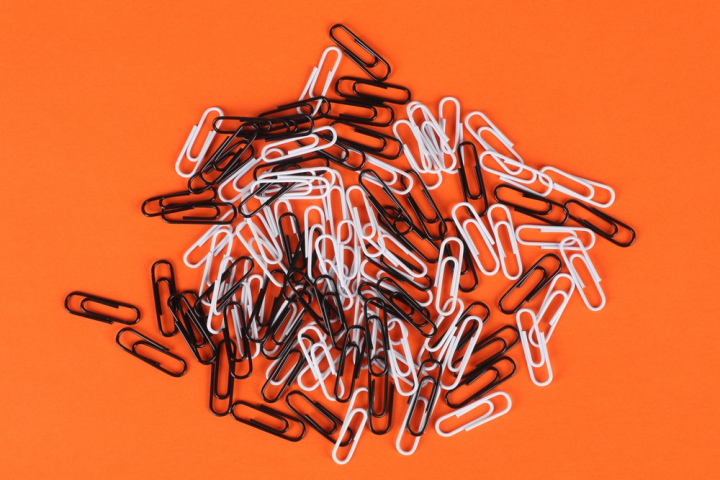 abstract,abundance,black and white,business,clamp,clip,close-up,color,conceptual,design,flatlay,graphic,illustration,image,many,orange background,paper clips,plastic,school,shape,wire