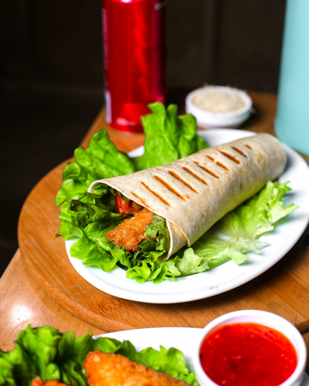 lavash,wrapped,grilled,doner,horizontal,lettuce,kebab,view,fast,wooden,salad,meat,chicken,table,food
