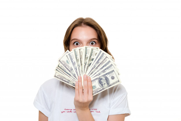 caucasian,bunch,paying,attractive,counting,excited,banknote,wealth,standing,looking,income,pretty,adult,holding,businesswoman,successful,rich,currency,portrait,happiness,bill,professional,young,financial,cash,payment,win,dollar,lady,finance,winner,success,happy,face,cute,shopping,girl,woman,money,hand