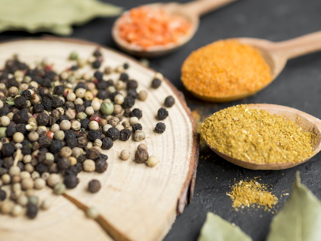 Wooden Spoon Filled With Various Spices Stock Photo - Download