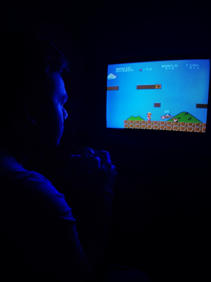childhood,classic,dark,game,gamer,indoors,male,man,mobile photography,nintendo,old,playing,retro,screen,super mario,super mario bros,television,tv,video game
