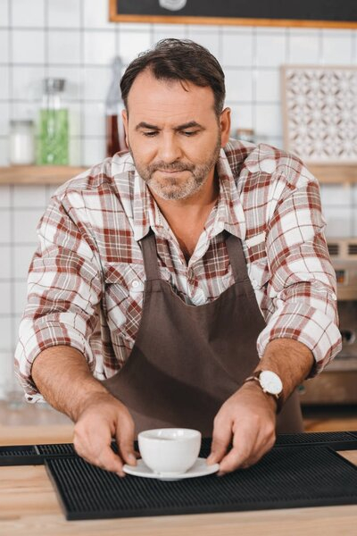 handsome,refreshing,liquid,work,caffeine,bartender,coffee,apron,person,middle aged,coffee break,cup,hot,barista,professional occupation,Caucasian Man,restaurant,cafe,mug,job,bar,young adult,energy,natura,worker,drink,delicious,cafeteria,old,profession,people,male,putting,depositphotos