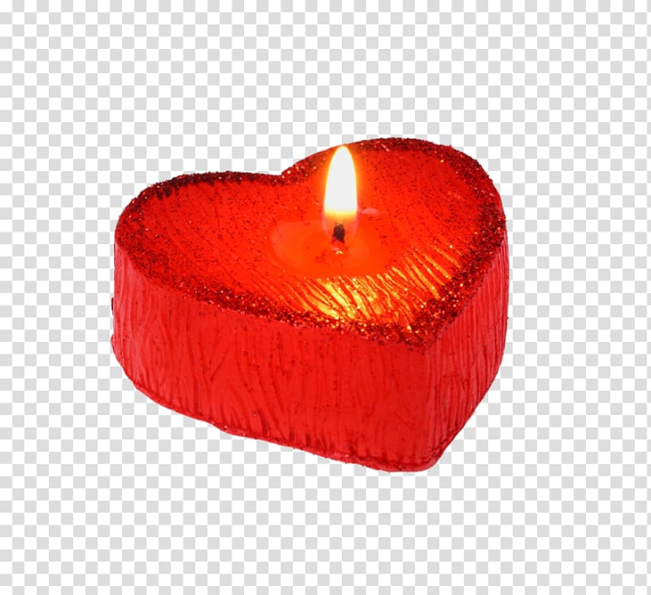 Burning heart shaped candle over red background, Stock image