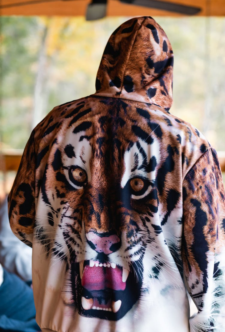 animal print,back view,blurry background,hoodie,vertical shot