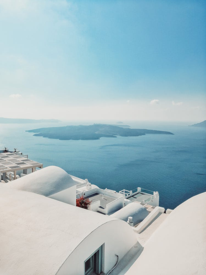 blue sky,building,greece,island,nea kameni,ocean,santorini,sea,vertical shot,water