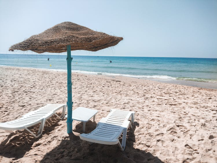 beach,beach chairs,beach umbrella,island,ocean,sand,sea,seashore,shore,summer,sun loungers,sunshade,water