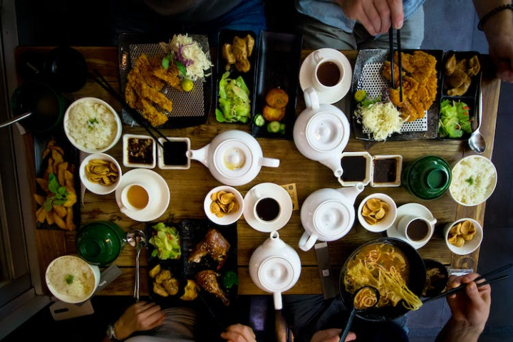 adult,asian food,celebration,color,cup,delicious,dinner,drink,food,food photography,from above,hands,indoors,meal,people,restaurant,sauces,set,table,tea,teapot,traditional,yummy