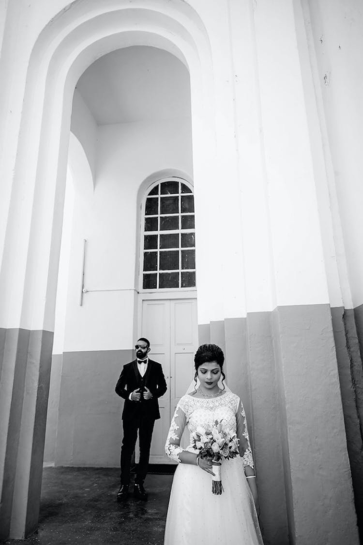 black and white,bride,building,ceremony,church,couple,groom,marriage,vertical shot,wedding