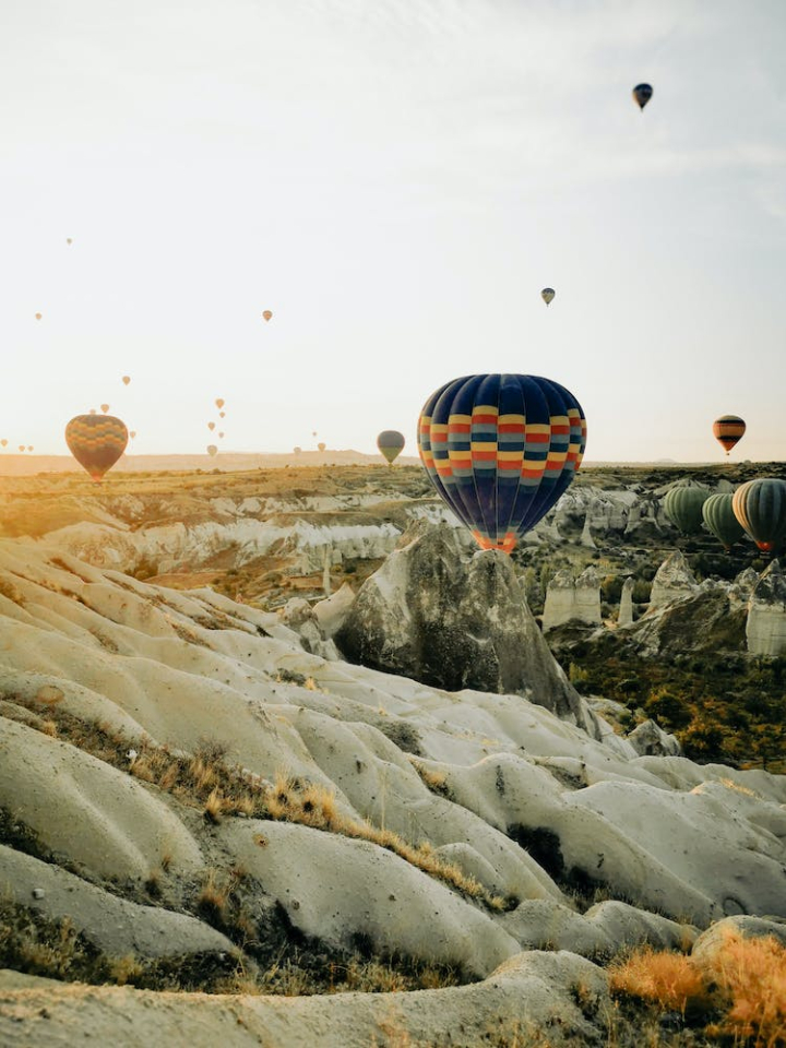 aircrafts,cappadocia,flying,hot air balloons,sky,turkey,vertical shot