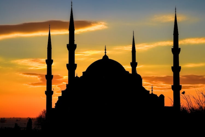 back lit,dramatic sky,islam,majestic,minarets,mosque,silhouette,sunset