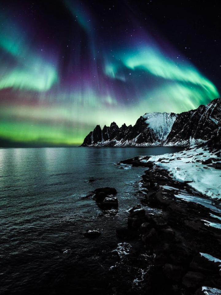 aurora borealis,evening,lake,landscape,light,mountain,nature,night,northern lights,norway,ocean,outdoors,sea,snow