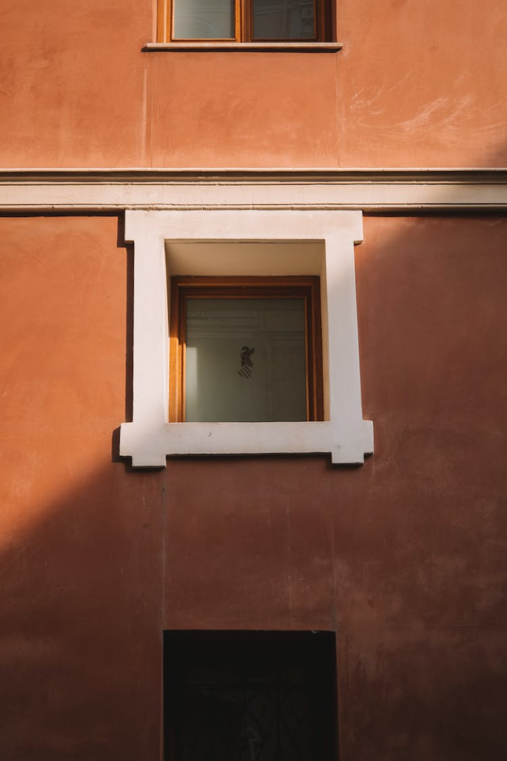 architecture,building,dirty,door,empty,family,home,house,indoors,interior design,outdoors,painting,picture frame,retro,stucco,urban,wall,window,wood