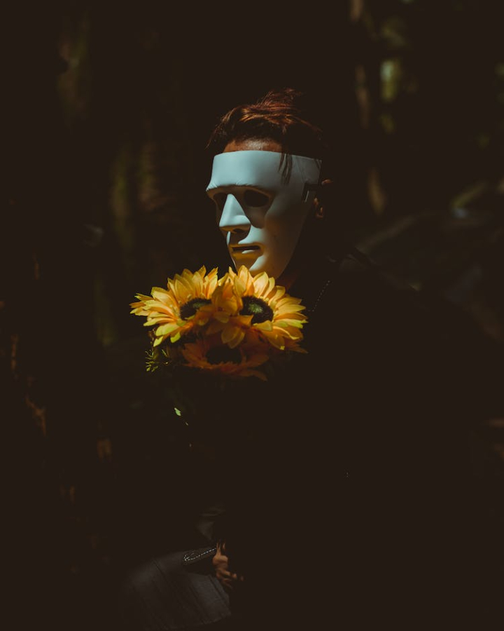 creepy,flora,flowers,man,mask,mystery,person,scary,sunflowers,wear