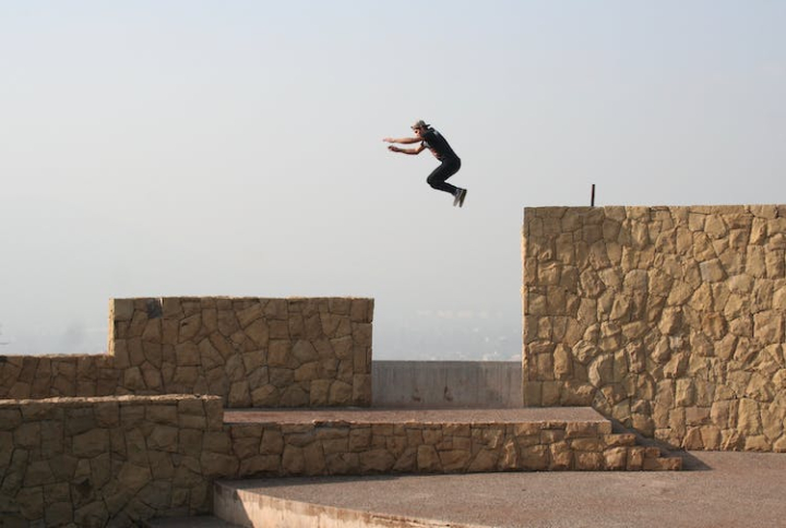 action,air,concrete,daylight,fun,hobby,hops,jump,jumping,man,motion,outdoors,parkour,performance,person,recreation,skill,street,style,travel,wear