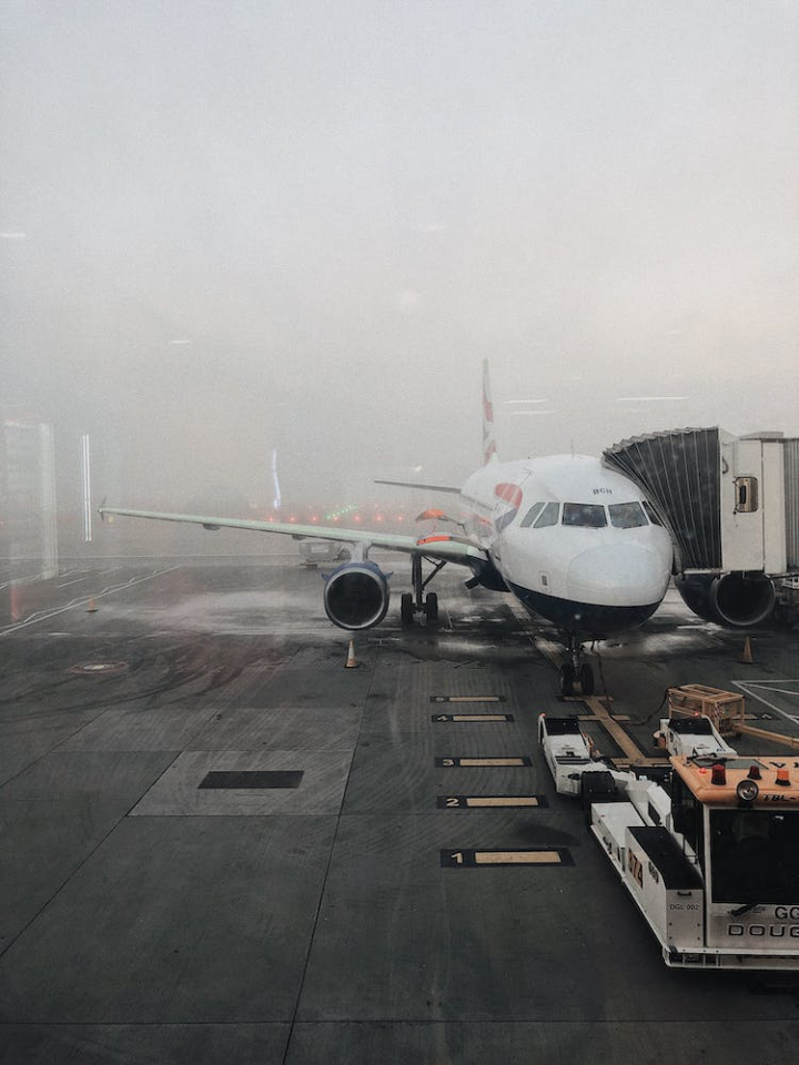 aircraft,airline,airliner,airplane,airport,aviation,business,flight,fog,foggy,glass window,plane,pollution,rain,runway,storm,tarmac,technology,transportation,transportation system,travel,vehicle,weather