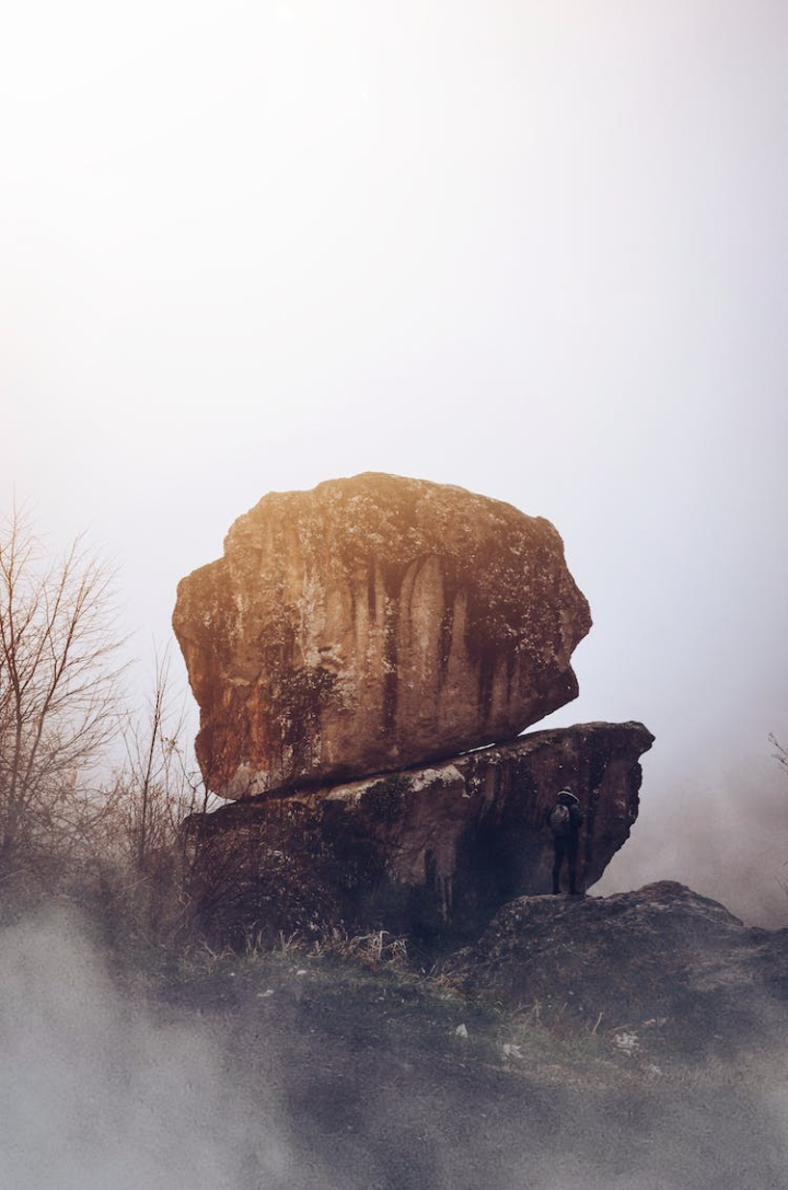 adventure,backpack,cold weather,dawn,desert,dusk,fog,foggy,geology,hike,hiker,ice,landscape,man,mist,mountain,mountains,nature,outdoors,person,rock,rocks,snow,solitude,standing,stone,sun,sunset,travel,trees,water,weather,winter