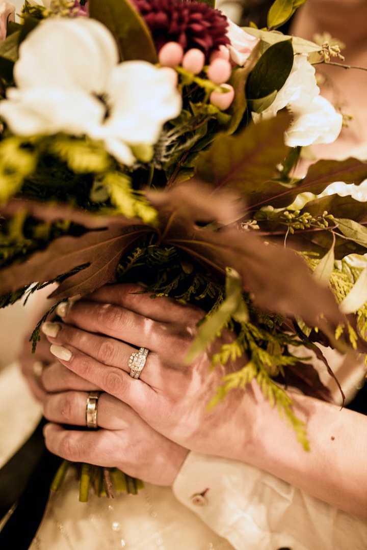 bloom,blooming,blossom,bouquet,bride and groom,close-up,couple,female,flora,flower arrangement,flowers,groom,hands,holding hands,humans,indoors,man,orchids,people,petals,photoshoot,skin,together,wear,wedding bouquet,woman