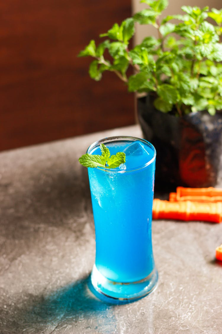 blue,cocktail,cold,cool,drink,glass,h2o,icee,juice,leaf,liquor,mint,mint leaves,ram,vodka