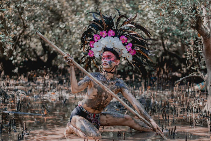 costume,festival,headdress,man,mud,person,portrait,traditional,tribe