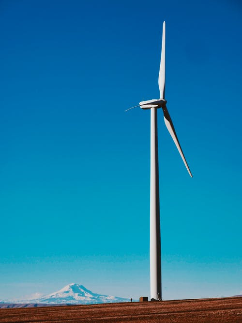 sky,windmill,natural environment,natural landscape,wind turbine,electricity,slope,turbine,line,wind farm,pexels