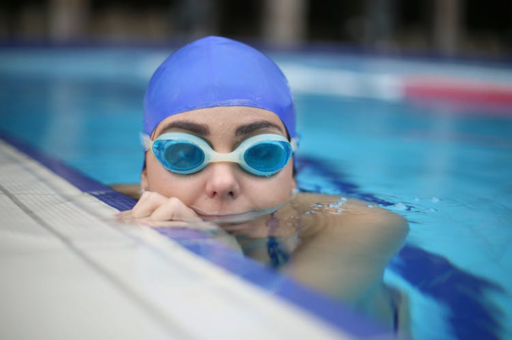 blur,close-up,dug out pool,female,fun,goggles,h2o,leisure,person,pool,poolside,recreation,sport,summer,swim,swim cap,swimmer,swimming,swimming gears,swimming pool,underwater,water,wet,woman