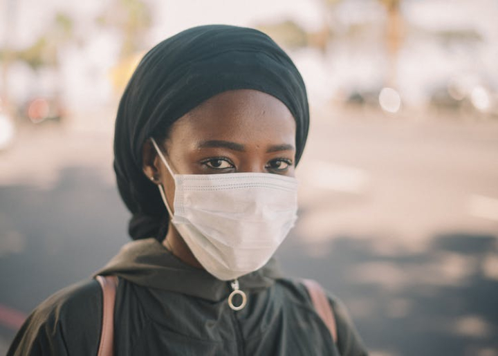 black,blurred background,city,coronavirus,cover face,covid,covid 19,culture,danger,daylight,daytime,disease,emotionless,epidemic,ethnic,female,headscarf,headshot,health care,healthy,horizontal,human face,illness,infection,jacket,lady,lifestyle,looking at camera,mask,medical,outdoors,outside,pandemic,prevent,protect,quarantine,safety,street,town,tradition,unrecognizable,virus,wellbeing,woman