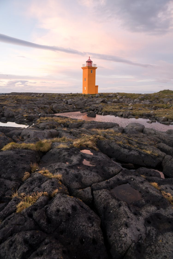 amazing,beauty,bright,calm,cloudy,coast,color,day,daylight,daytime,destination,distance,europe,famous,grass,grindavik,ground,hopsnesviti,iceland,icelandic,land,landmark,landscape,lighthouse,location,moss,nordic,north,northern,orange,outdoors,outside,picturesque,puddle,rocky,rough,rural,scenic,seaside,shore,solitude,spectacular,tender,terrain,tower,tranquil,travel,vertical shot,wet