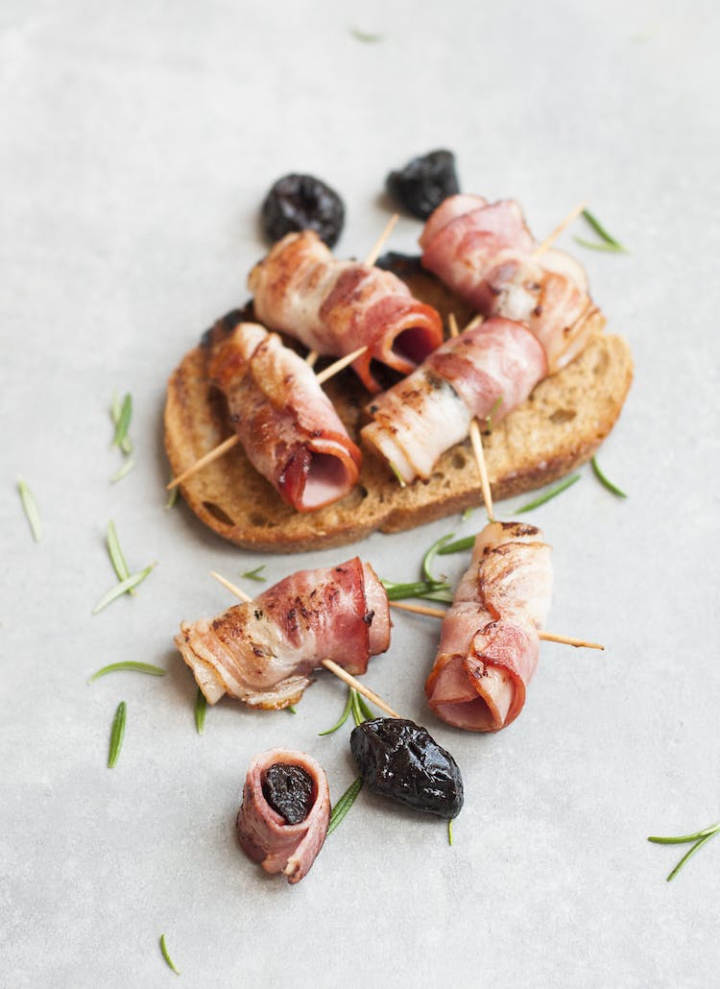 appetizer,bacon,bread,cooking,cuisine,delicious,dinner,dish,eat,eating,epicure,food,fried,herbs,meal,meat,nutrition,plum,pork,prunes,rosemary,slice,taste,tasty,toothpick