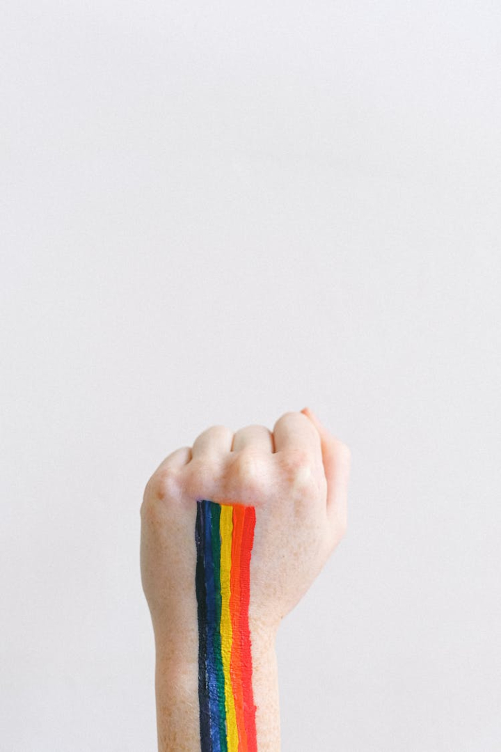 bodypaint,conceptual,fist,gay,gay pride,hand,lgbt,lgbtq,pride,pride month,rainbow,strength,white background