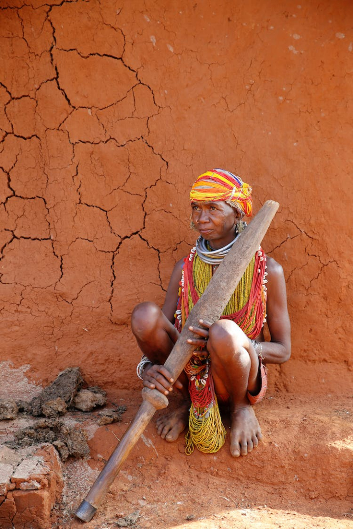 ethnicity,indigenous person,sitting,traditional wear,tribal
