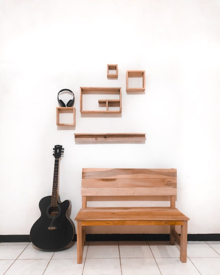 acoustic guitar,bench,headphones,minimalism,musical instrument,still life,vertical shot,wall,wall decor,wooden