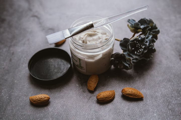 almond,aroma,aromatic,bath,beauty,body care,brush,cleanse,composition,cosmetic,cosmetology,cream,decorative,dermatology,flower,fragrant,fresh,from above,gray,high angle,hydrate,hygiene,indoors,ingredient,jar,layout,mask,moisture,natural,nourish,organic,pamper,procedure,product,rejuvenate,routine,scatter,skin care,smooth,spa,table,therapy,treat,wellness
