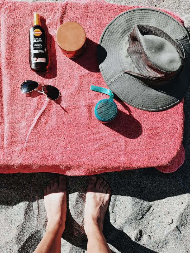 beach,close-up,essentials,legs,person,sand,summer,top view,vertical shot