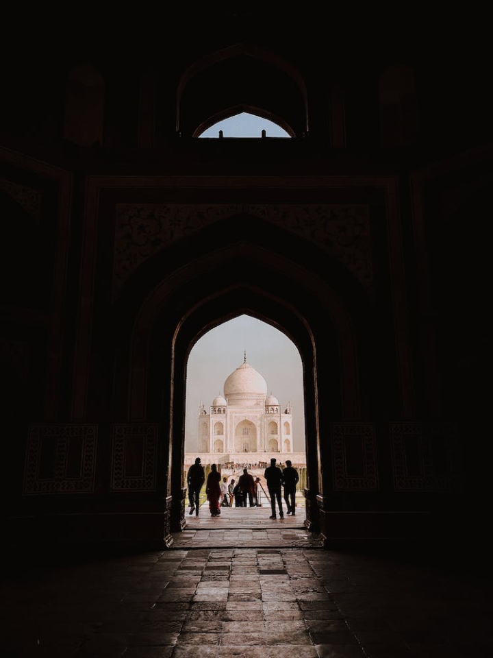 arched,entrance,famous landmark,hallway,historic,islamic architecture,minarets,religious,taj mahal,tourist attraction,tourist spot,travel destination,vertical shot