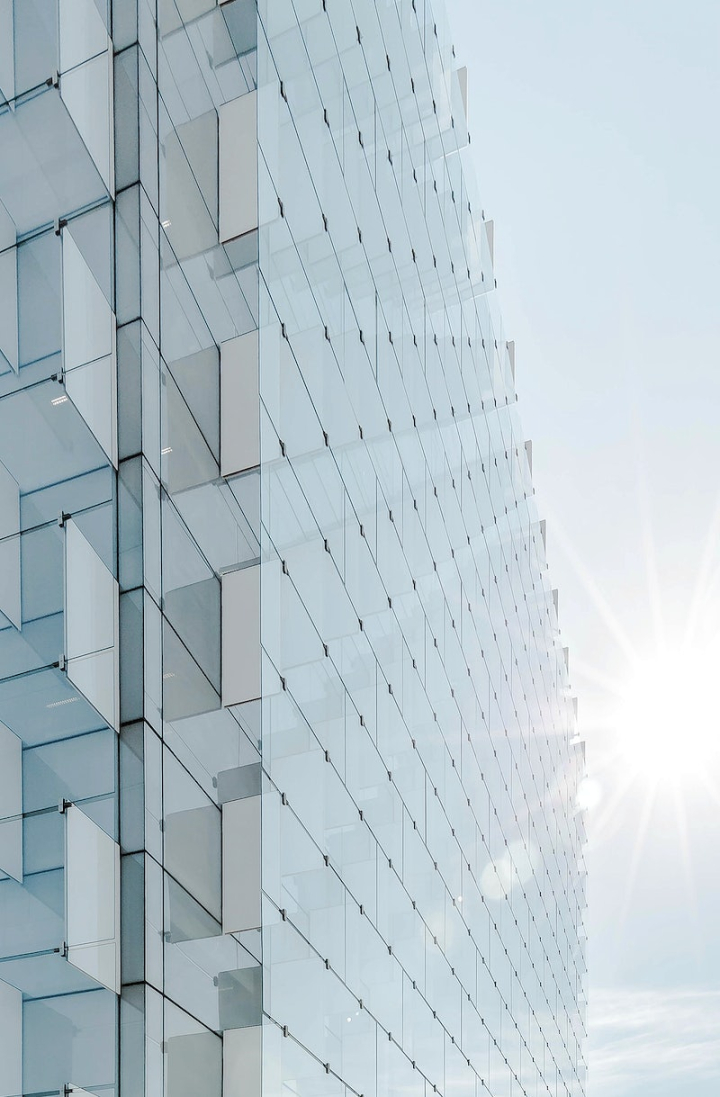 office building,architecture,glass building,geometry,reflection,city view,view,abstract building,wallpaper sky,sunlight,skyscraper,sunlight building,rawpixel