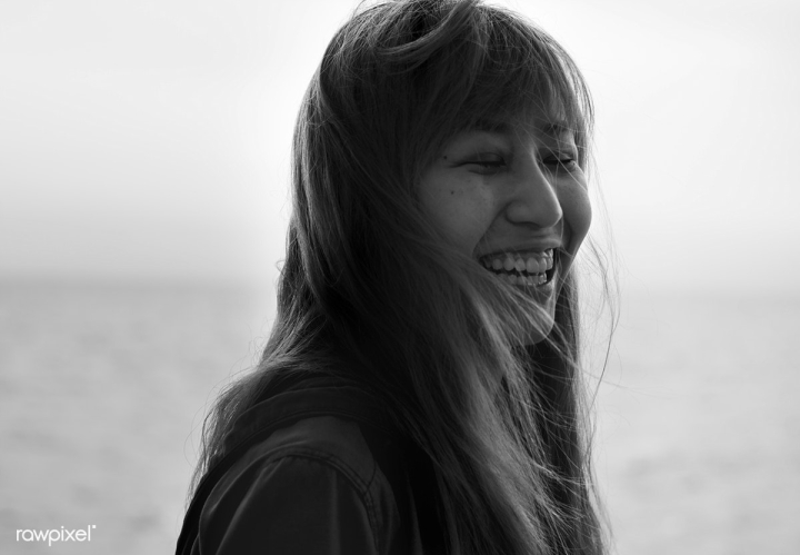 asian,cheerful,closed eyes,closeup,face,free,giggling,girl,grayscale,happy,person,portrait,smiling,windy,woman