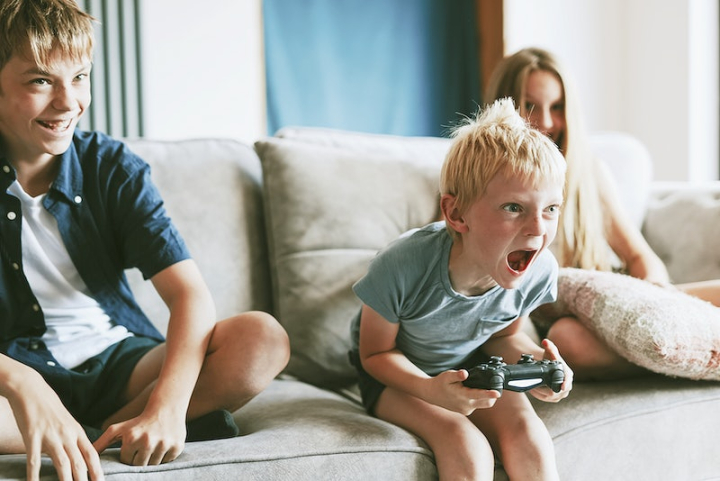 gaming,children gaming,angry,living,kid angry,children,angry person,couch,family home,teenage boy,child screaming,teenager,rawpixel