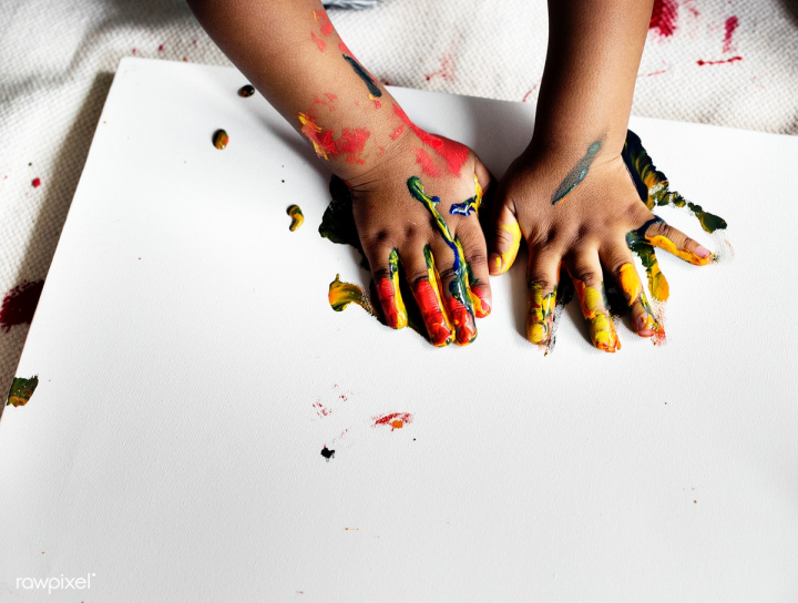 child,kid,african descent,african,activity,art,black,closeup,colors,enjoy,hands,hobby,indoors,leisure,painting,papers,pastime
